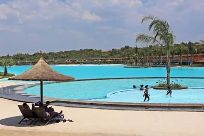 a group of people in a pool at a resort at The Blyde - Little Place, Lots of Relaxation in Pretoria