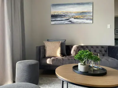 a living room with a couch and a table at Spring Acres Apartment living in Nelspruit