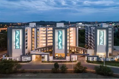 a large building with lights on the side of it at Regency Hotel Apartment @ 4th in Pretoria
