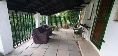 a porch with a cover on the side of a house at Sister's Haven in Nelspruit