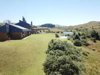 an aerial view of a house with a large yard at Amberley Mountain Reserve in Dullstroom