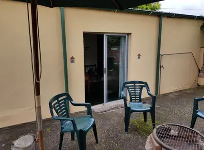 a group of chairs sitting outside of a house at Guesthouse 914 in Sabie