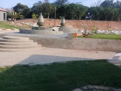 a set of concrete steps in a park with grass at SIMA SILVER LODGE in Tzaneen