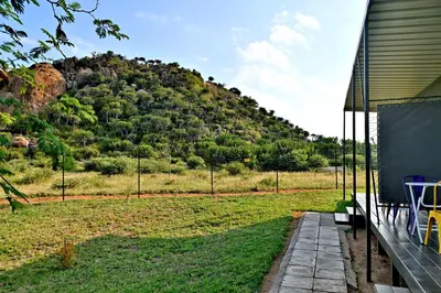 a house with a view of a mountain at SleepOver Matoks in Matoks