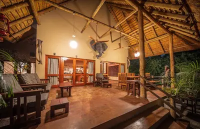 a person is doing a trick in a living room at Bush Villas on Kruger in Phalaborwa