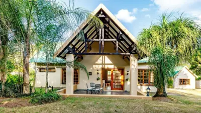 a house with a gambrel roof at Country Lane Lodge in White River