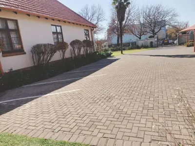 a brick sidewalk in front of a house at Oregon Place Guest House in Middelburg