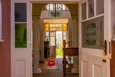 a hallway of a home with an open door at Westlodge at Graskop B&B in Graskop