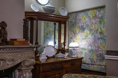 a dressing room with a mirror and a dresser at Westlodge at Graskop B&B in Graskop