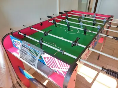 a ping pong table with a soccer ball on it at JB Countrylife Accommodation in Koedoe