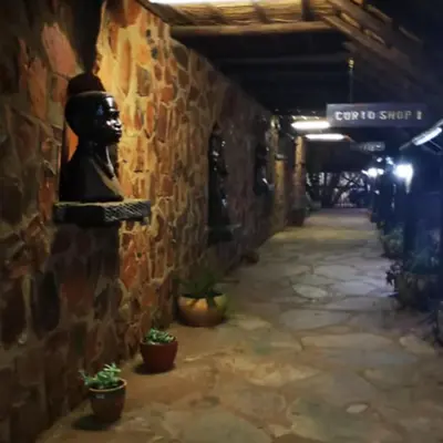 an alley with a statue on the side of a building at Glen Afric Country Lodge in Hartbeespoort