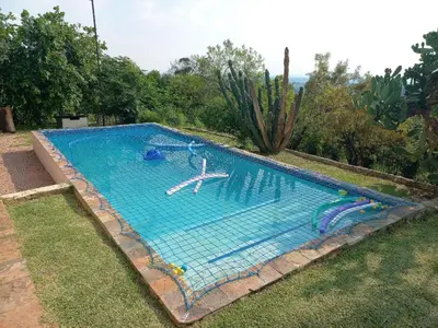 a large swimming pool with an anchor in the water at JB Countrylife Accommodation in Centurion