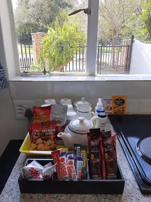 a tray of food on a counter next to a window at Kruger Southern Cross in Malelane