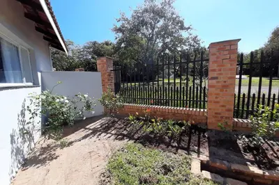 a fence in front of a house at Kruger Southern Cross in Malelane