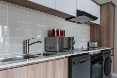 a kitchen with a sink and a microwave at #Alimama Spaces Blyde Haven in Pretoria