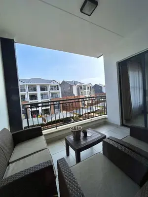 a balcony with a table and chairs and a large window at 1152 @The Blyde Riverwalk - Crystal Lagoon in Pretoria