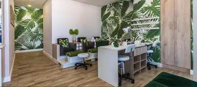 a dermatologists office with green chairs and a desk at 1152 @The Blyde Riverwalk - Crystal Lagoon in Pretoria