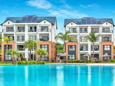 a building with solar panels on top of a swimming pool at 1152 @The Blyde Riverwalk - Crystal Lagoon in Pretoria