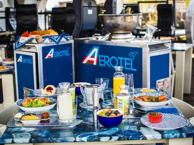 a table topped with bowls of food and milk at Aerotel in Hoedspruit