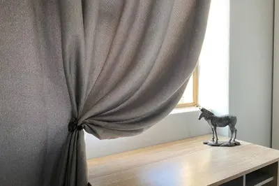 a statue of a horse on a table next to a window at Centurion Fully furnished lock up&go 1 bedroom apartment in Centurion