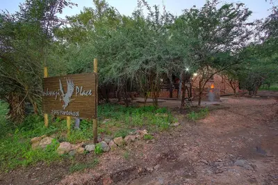 a sign in the middle of a dirt road at Inkwazi Place in Marloth Park
