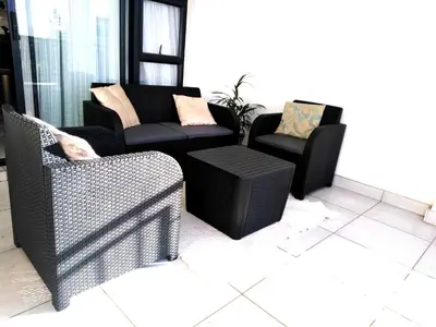 a living room with two chairs and a couch at The Blyde Riverwalk Estate, R104 Bronkhorstspruit Road in Pretoria