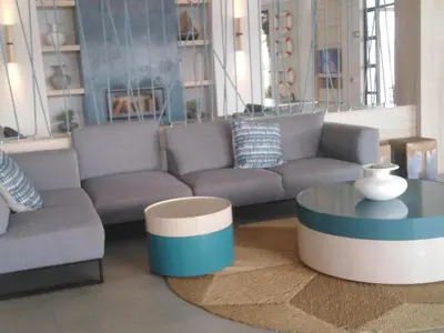 a living room with a couch and a coffee table at The Blyde Riverwalk Estate, R104 Bronkhorstspruit Road in Pretoria