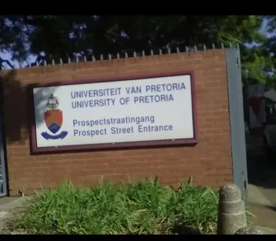 a sign for the university of pittsburgh on a brick wall at Hatfield, Grosvenor Private apartment. in Pretoria