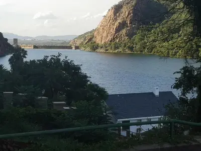 a view of a body of water with a mountain at Metsing at Harties in Hartbeespoort