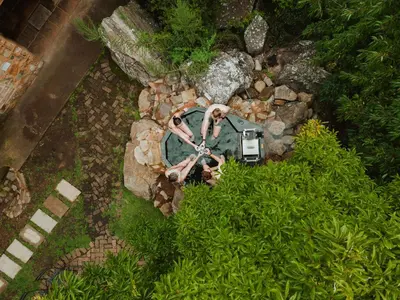 an overhead view of a garden with a bench and rocks at Migrate Portfolio in Dullstroom