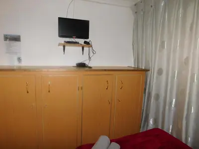 a bedroom with a tv on top of a cabinet at Fouriestreet 199 Bed and Breakfast in Mokopane