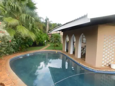 a swimming pool in front of a house at Fouriestreet 199 Bed and Breakfast in Mokopane