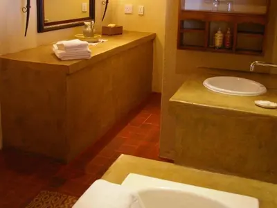 a bathroom with a sink and a counter with a sink at Bohm's Zeederberg Country House in Hazyview