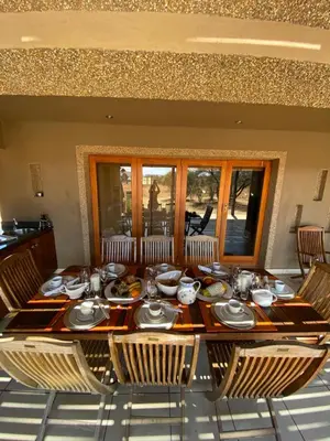 a table with plates of food on top at Luna rossa 19 Zebula golf course and spa resort in Mabula