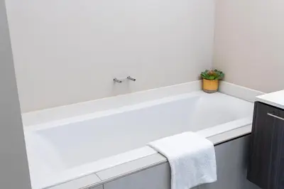 a white sink in a kitchen with a counter at Menlyn Apartment - 2 Bedroom Apartment in Pretoria