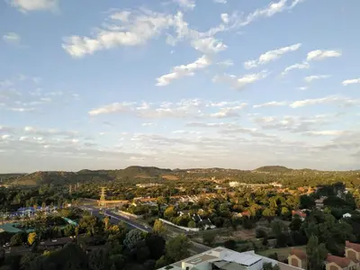 an aerial view of a small town with mountains at Menlyn Residence - Studio Apartment in Pretoria