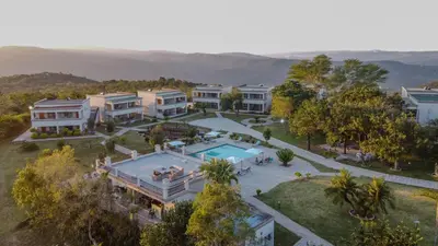 an aerial view of a house with a swimming pool at ASANTE MOUNTAIN LODGE in Hazyview