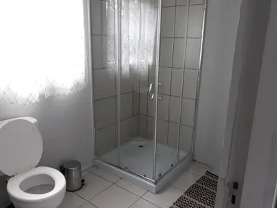 a bathroom with a shower and a toilet at Wild Escape in Marloth Park