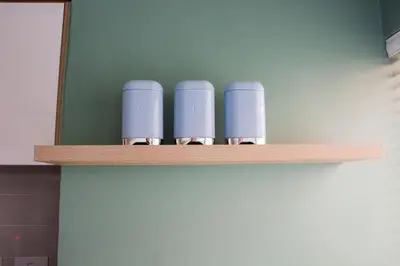 a wooden shelf with four blue cups on it at 150 The Blyde Crystal Clear Lagoon 3 Bedroom Garden Apartment in Pretoria
