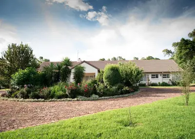 a house with a garden in front of it at Amohela Guesthouse in Midrand