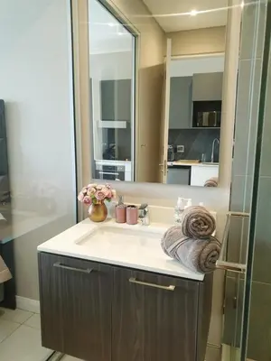 a bathroom with a sink and a mirror at Menlyn Maine in Pretoria