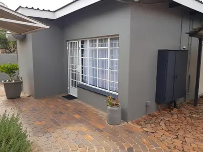 a house with a window and a tv on the side of it at Accommodation@Park1285 in Pretoria