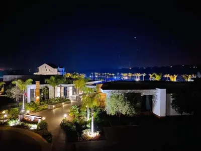 a view of a building at night with lights at The Blyde Modern Oasis Pretoria in Pretoria