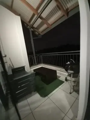 a room with a balcony with a bench and a table at The Blyde Modern Oasis Pretoria in Pretoria