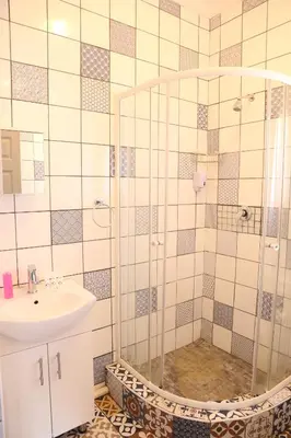 a bathroom with a shower and a sink at Casa De Jardim Guesthouse in Centurion