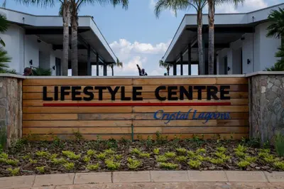 a sign for a life service center in front of a building at Lush Living The Blyde Riverwalk Estate Unit 101 in Pretoria