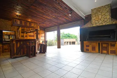 a large room with a kitchen with a large window at Upmarket Villa with pool & lush garden in Pretoria