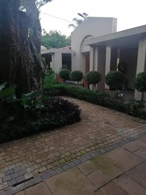 a brick walkway in front of a building at 180 On Anderson Guest House in Pretoria