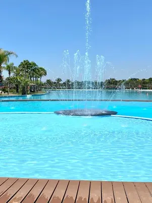 a fountain in the middle of a pool of water at The Blyde 104 in Pretoria