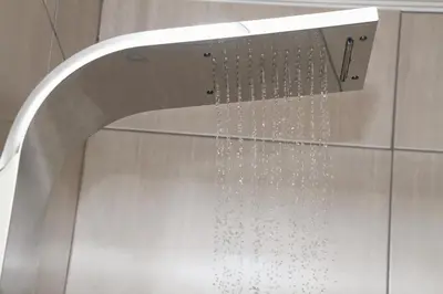 a shower with water coming out of it at Beautiful Studio Cottage at Menlyn Maine in Pretoria